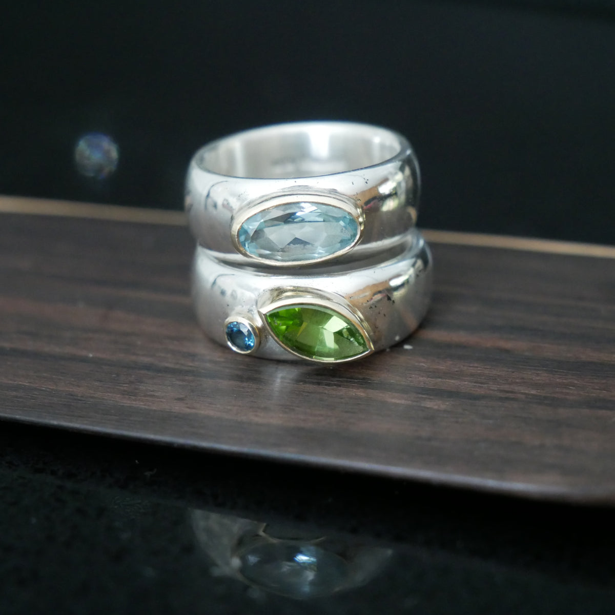 Wide silver and gold ring with oval Topaz