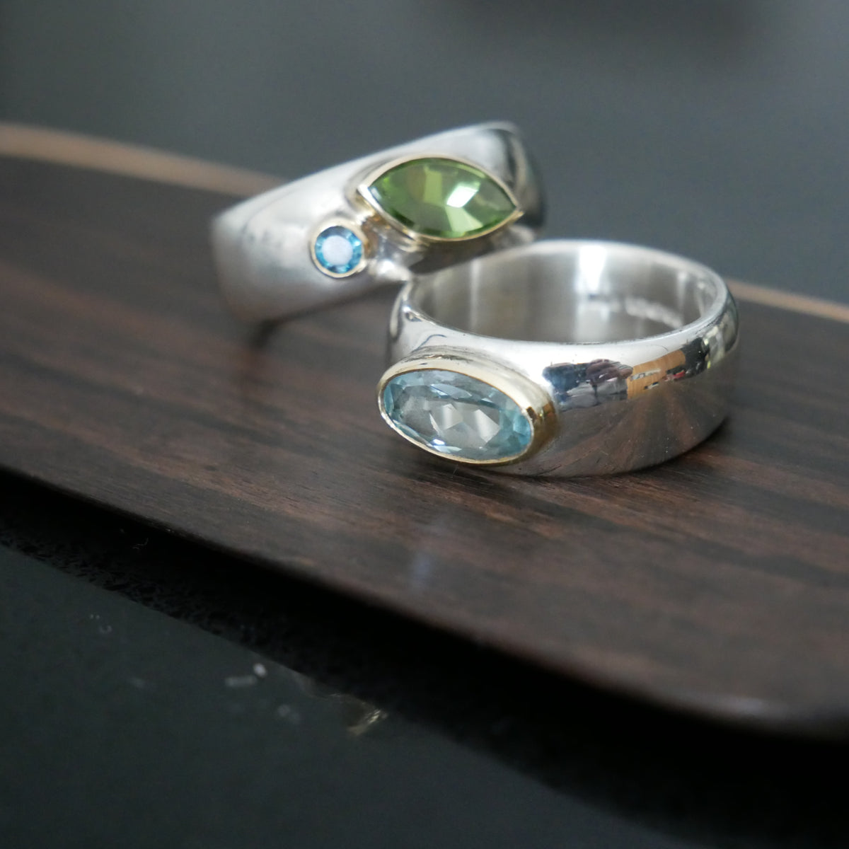 Wide silver and gold ring with oval Topaz