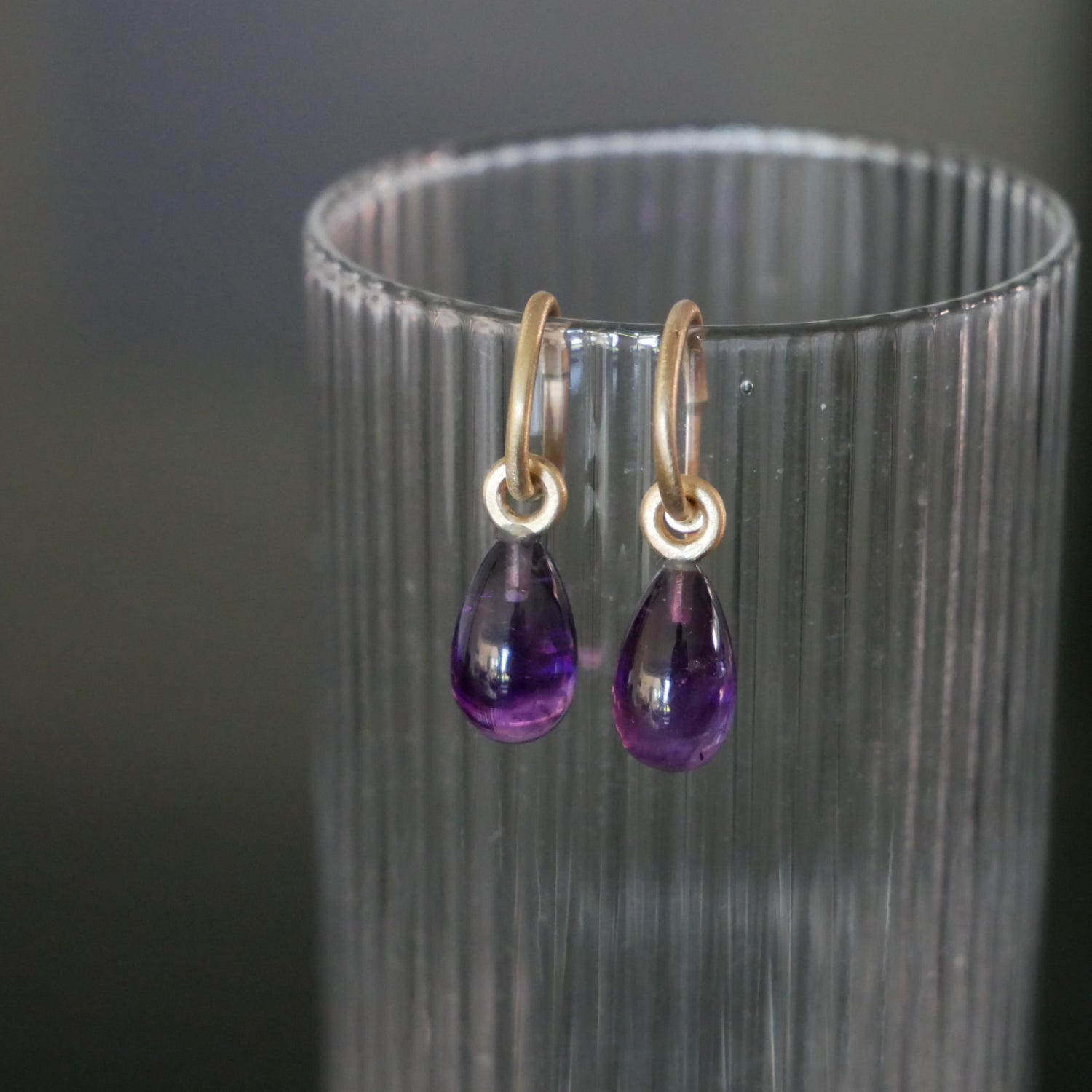 Tiny 9ct gold hoops with Amethyst drops