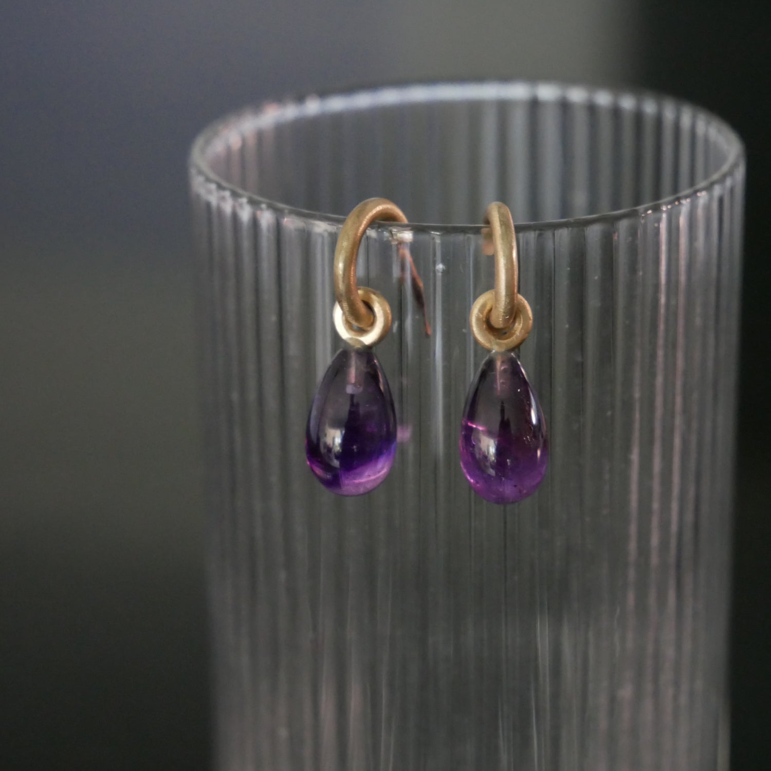 Tiny 9ct gold hoops with Amethyst drops
