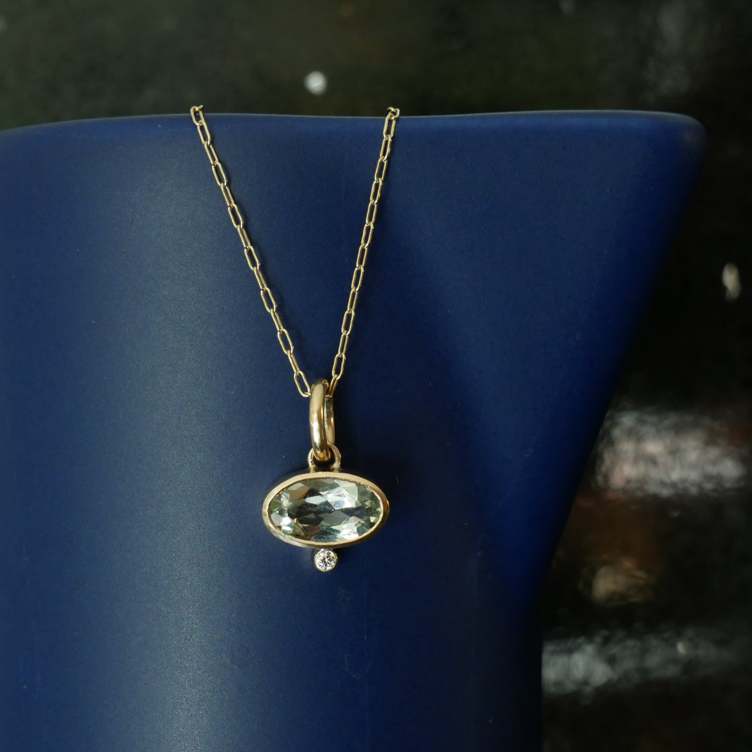 praisalite and diamond pendant