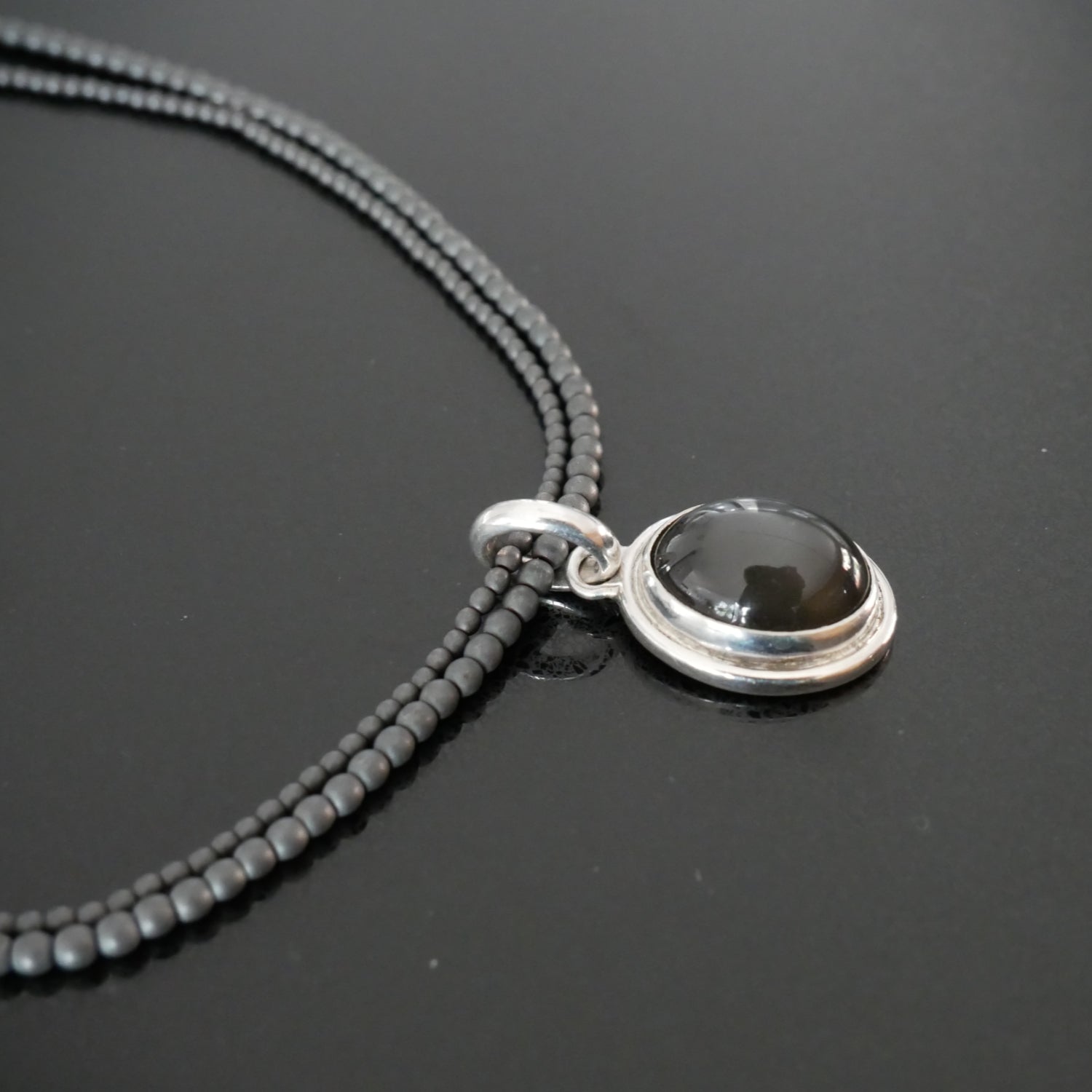 black moonstone and haematite pendant