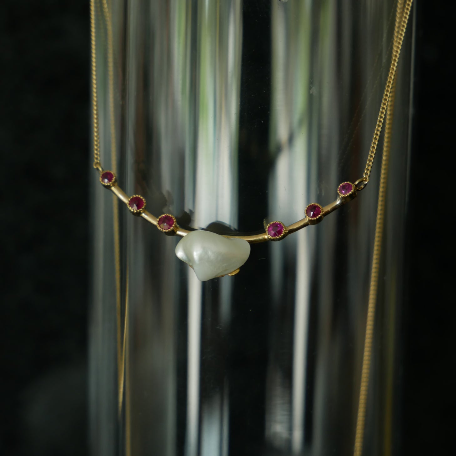 18ct gold baroque pearl and ruby necklace.