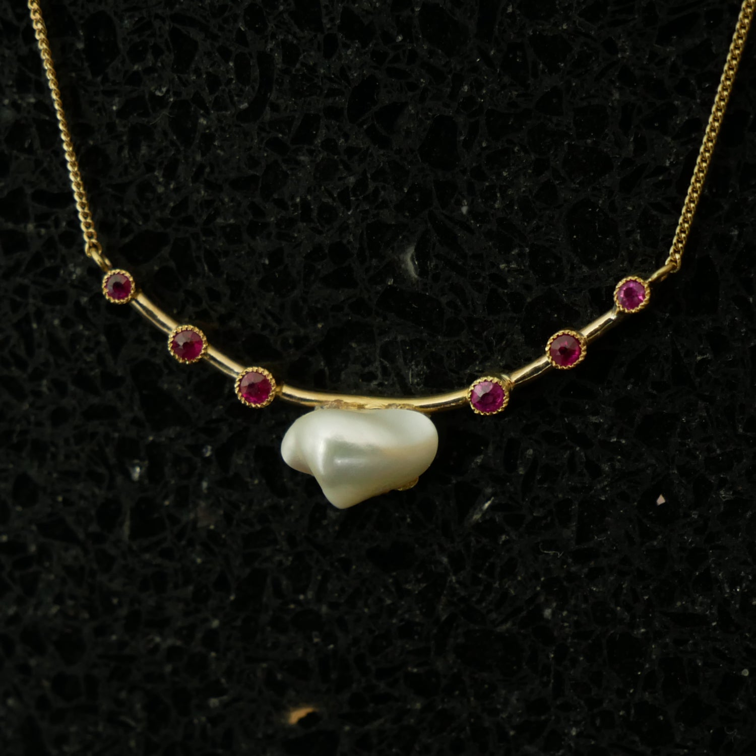 18ct gold baroque pearl and ruby necklace.