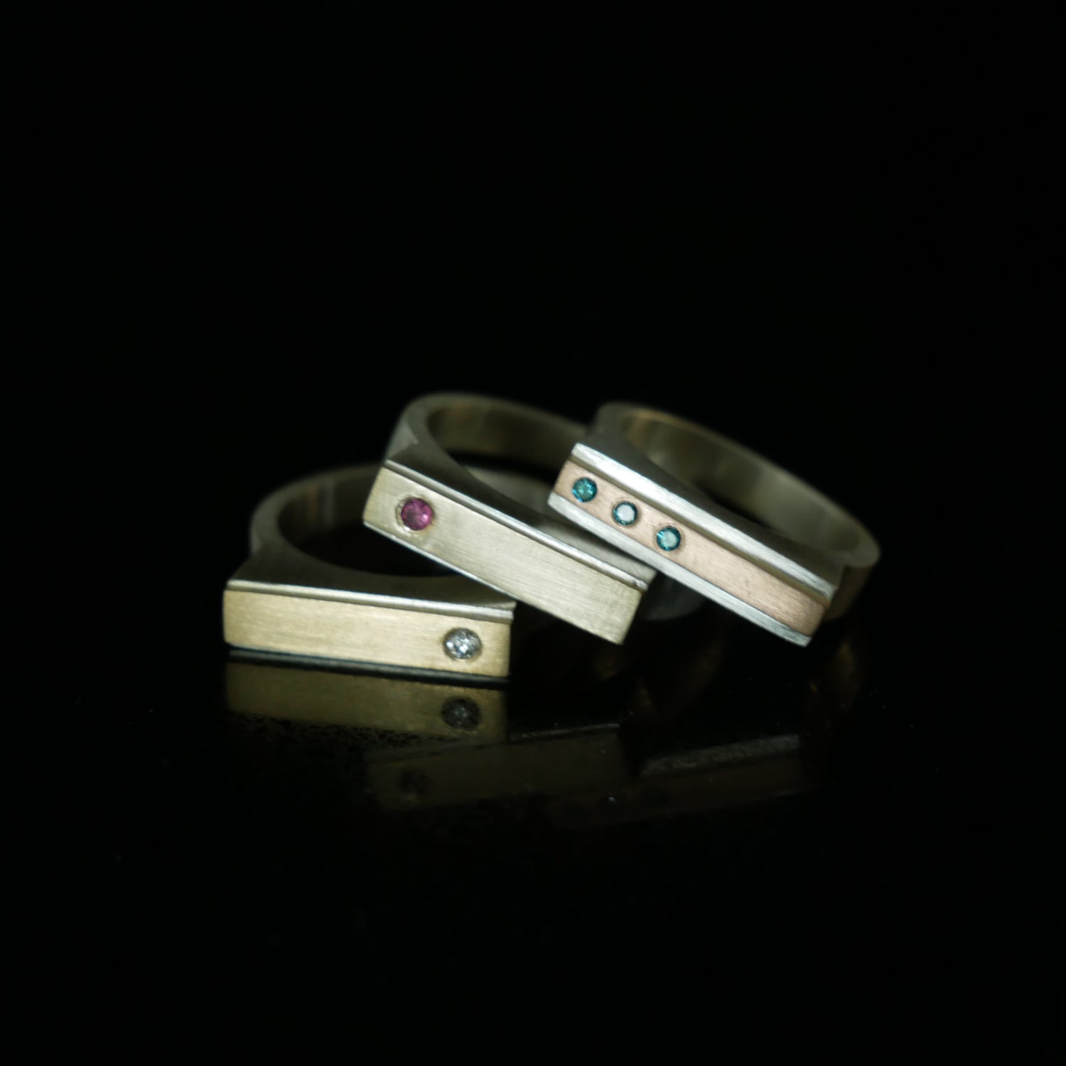 geometric silver and gold rings