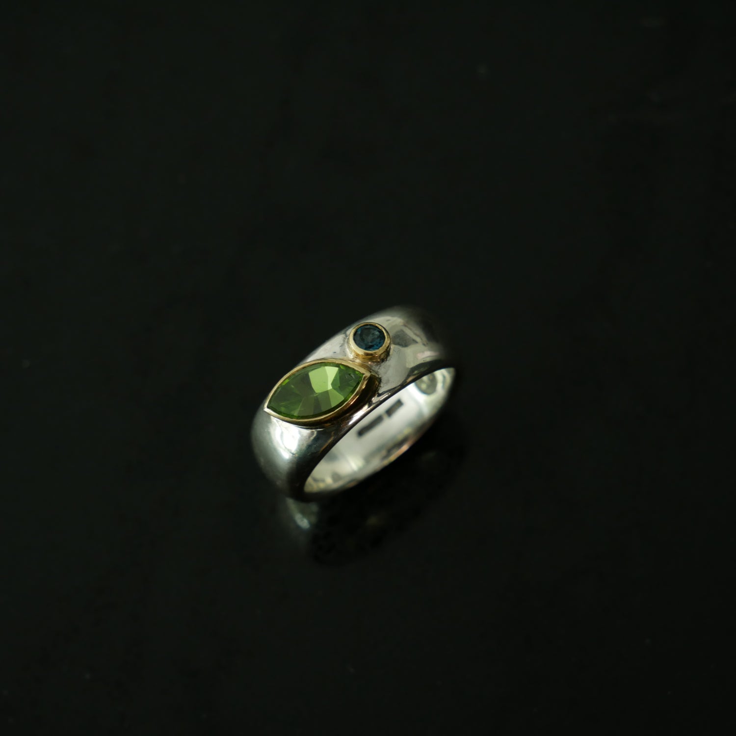 wide silver ring with peridot and topaz