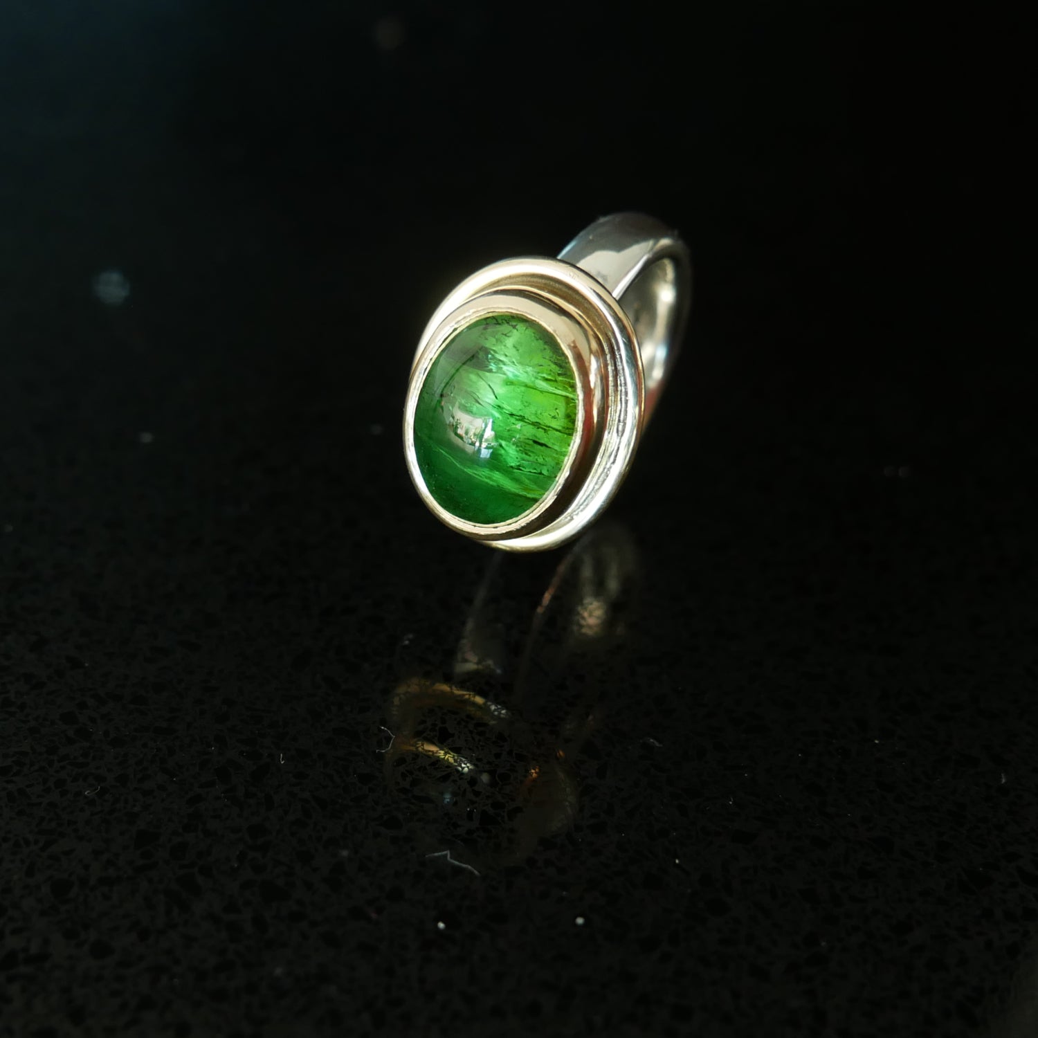 Green tourmaline gold and silver ring