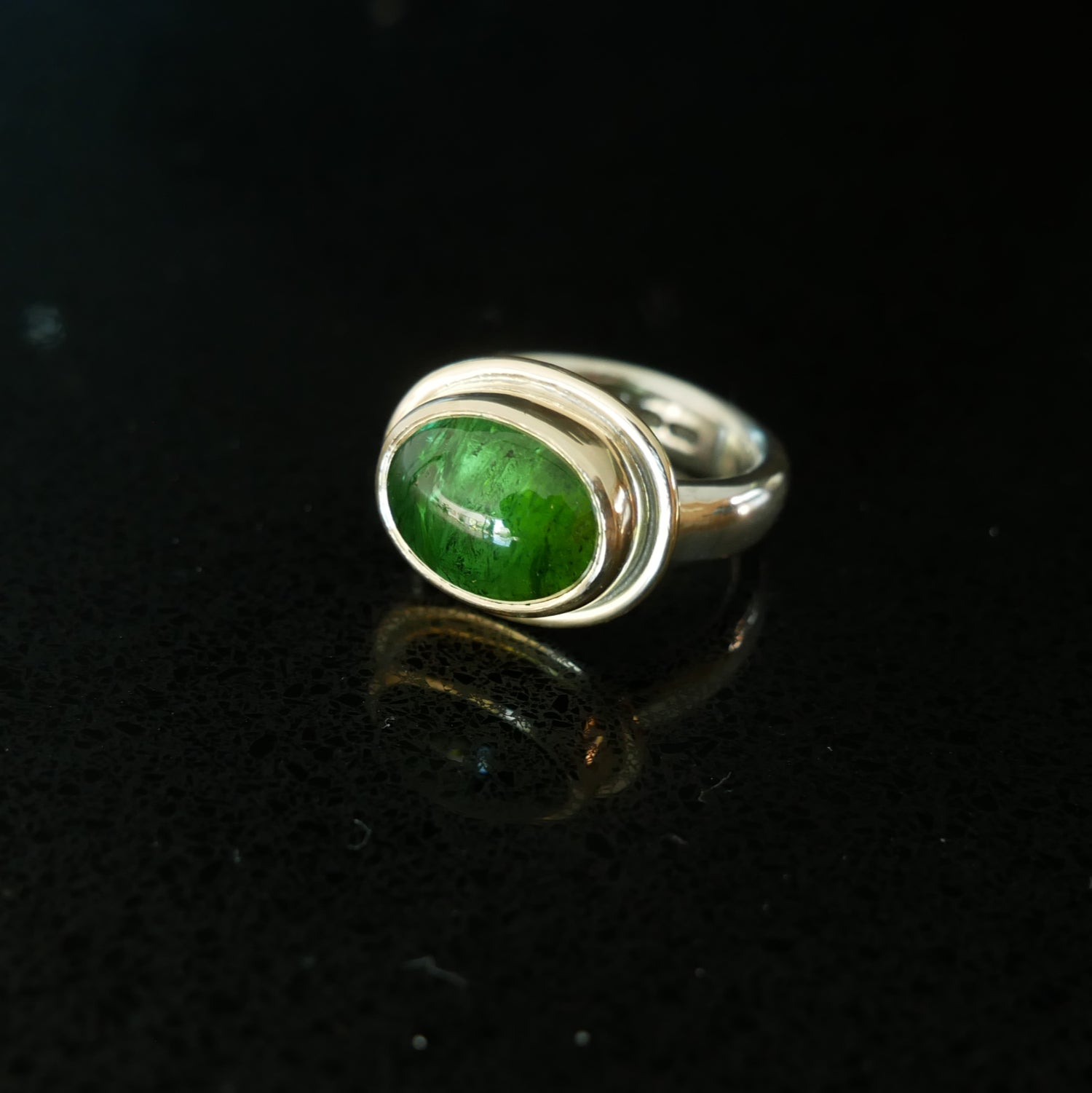 Green tourmaline gold and silver ring