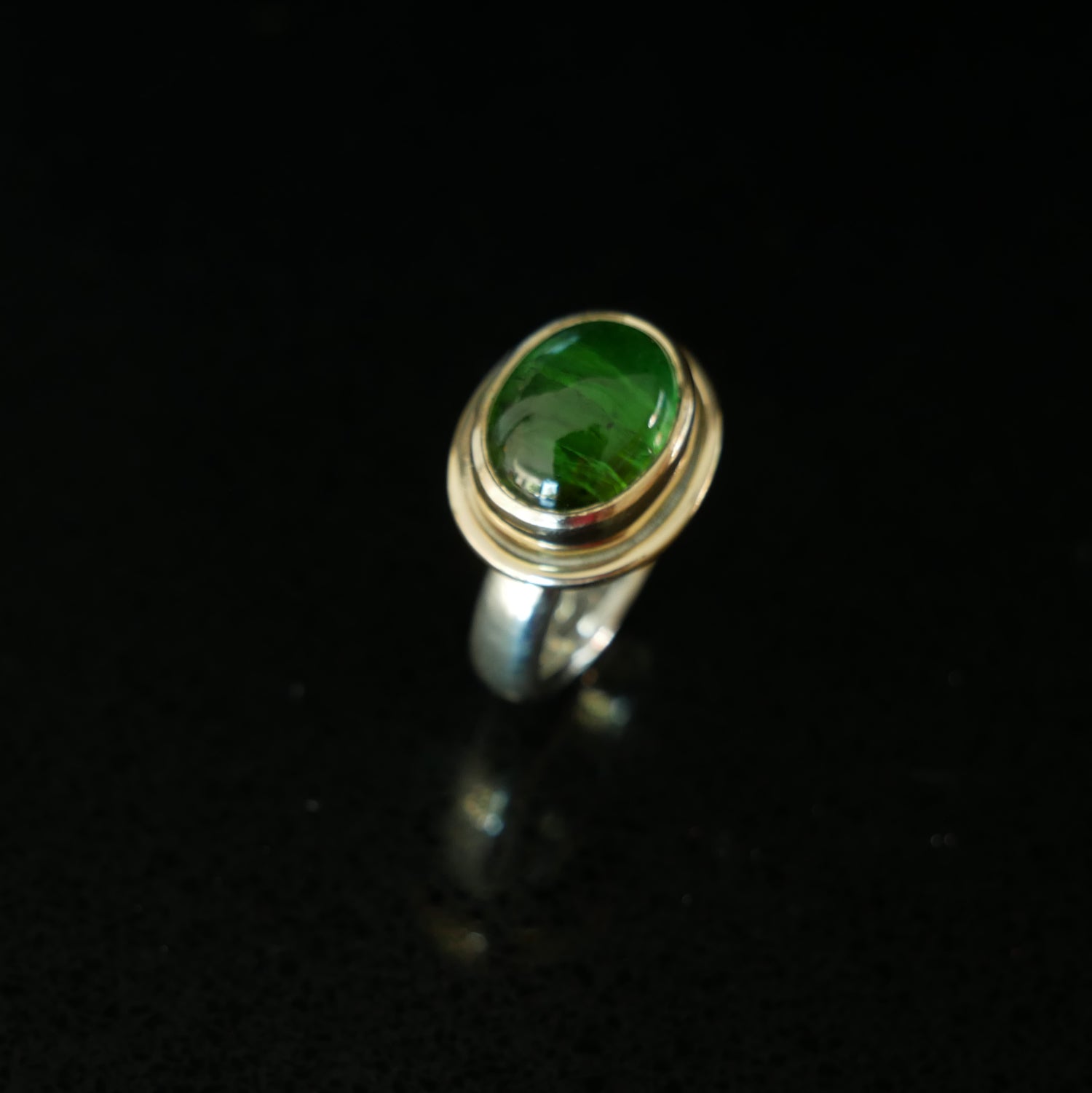 Green tourmaline gold and silver ring