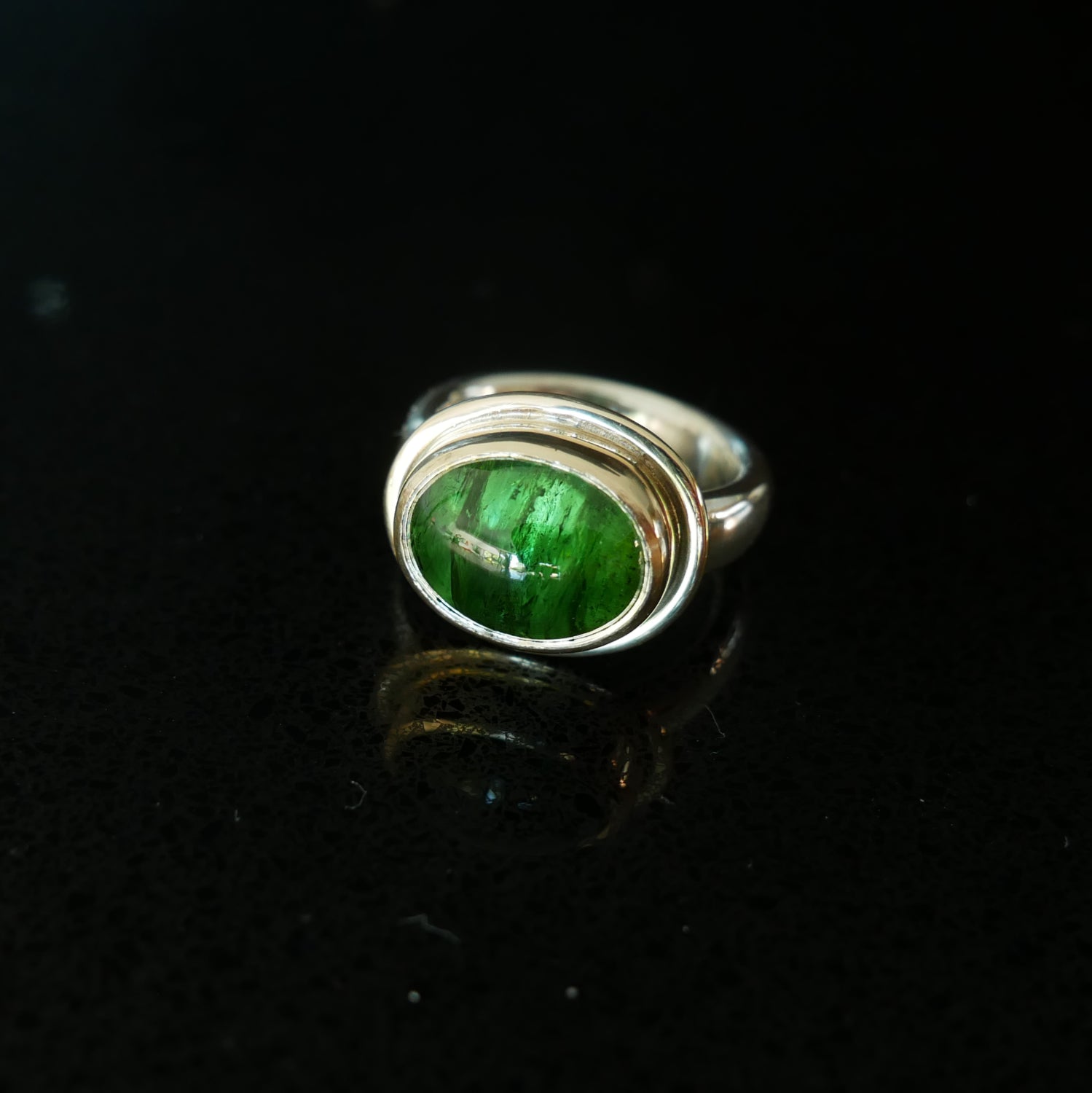 Green tourmaline gold and silver ring
