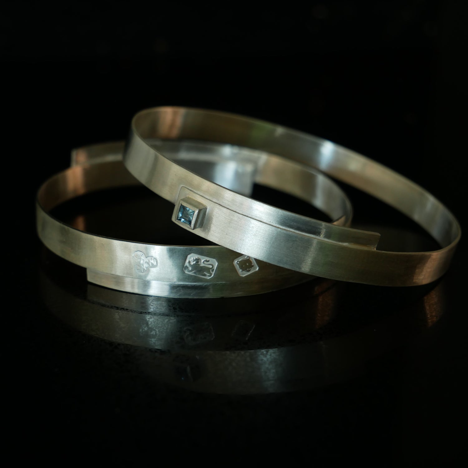 Overlap silver bangles