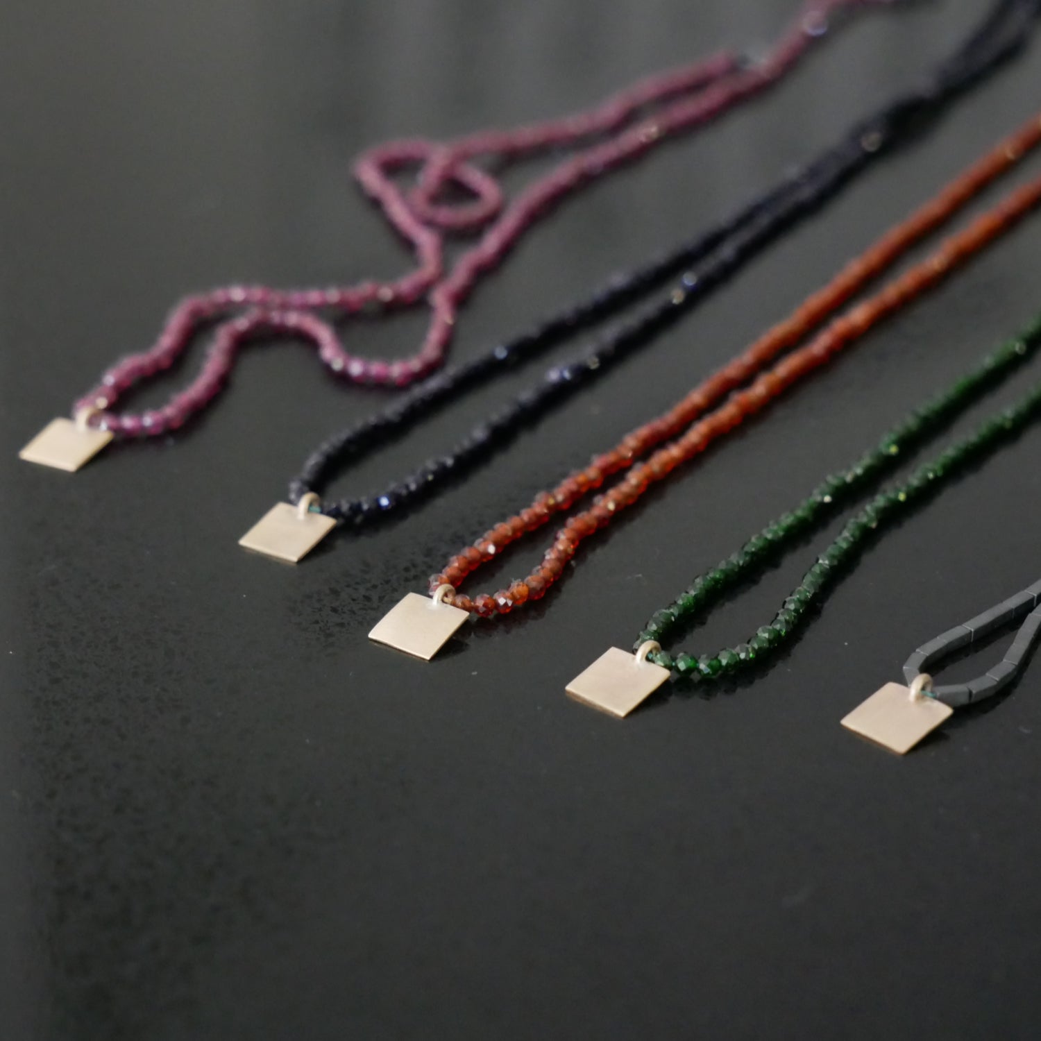 Delicate bead necklace with 9ct gold square