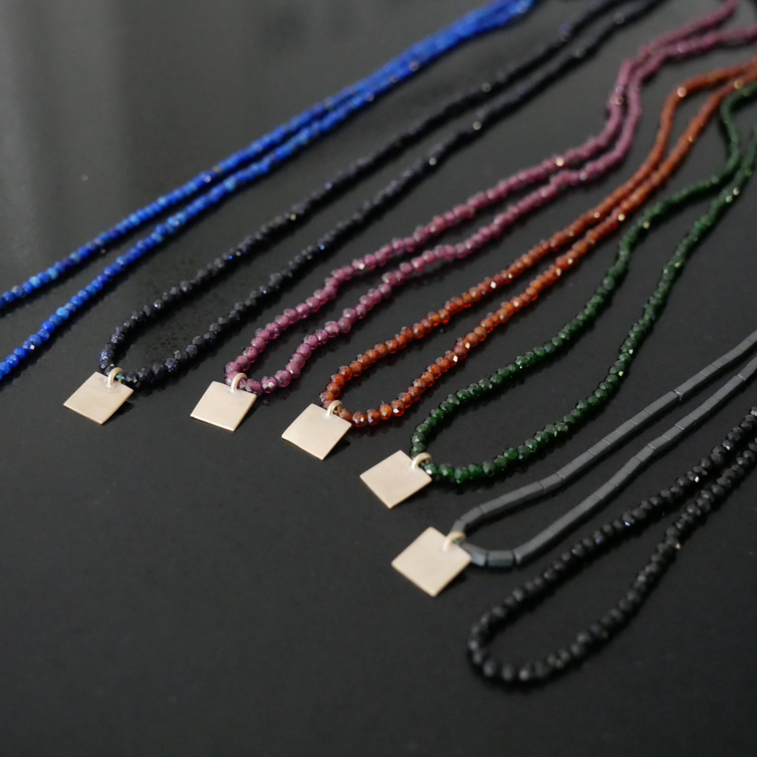 Delicate bead necklace with 9ct gold square