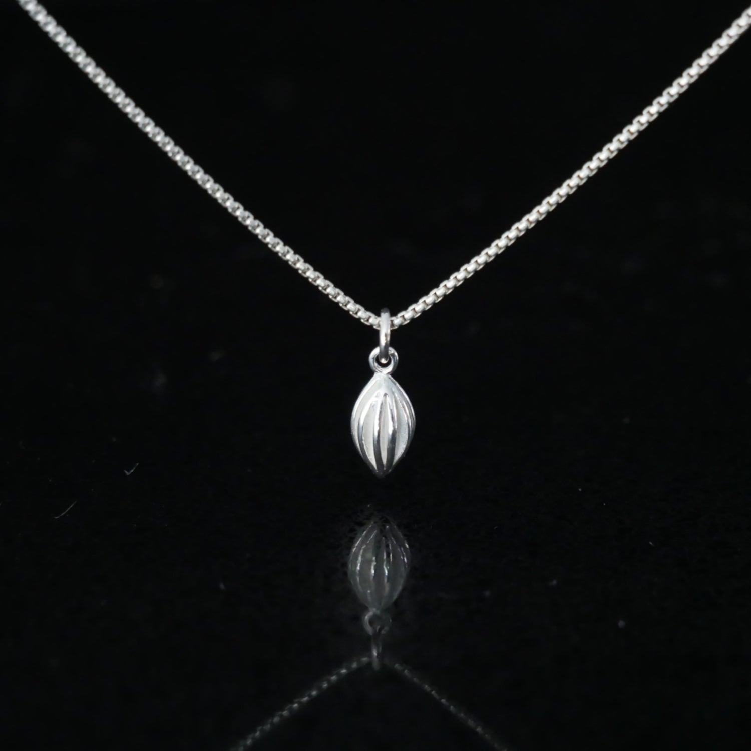 tiny silver pod necklace