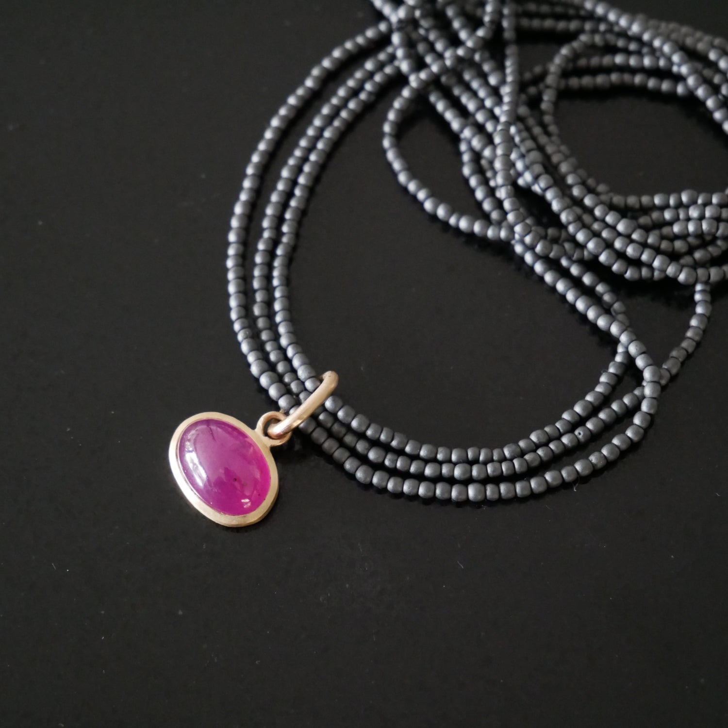 18ct gold ruby and haematite necklace