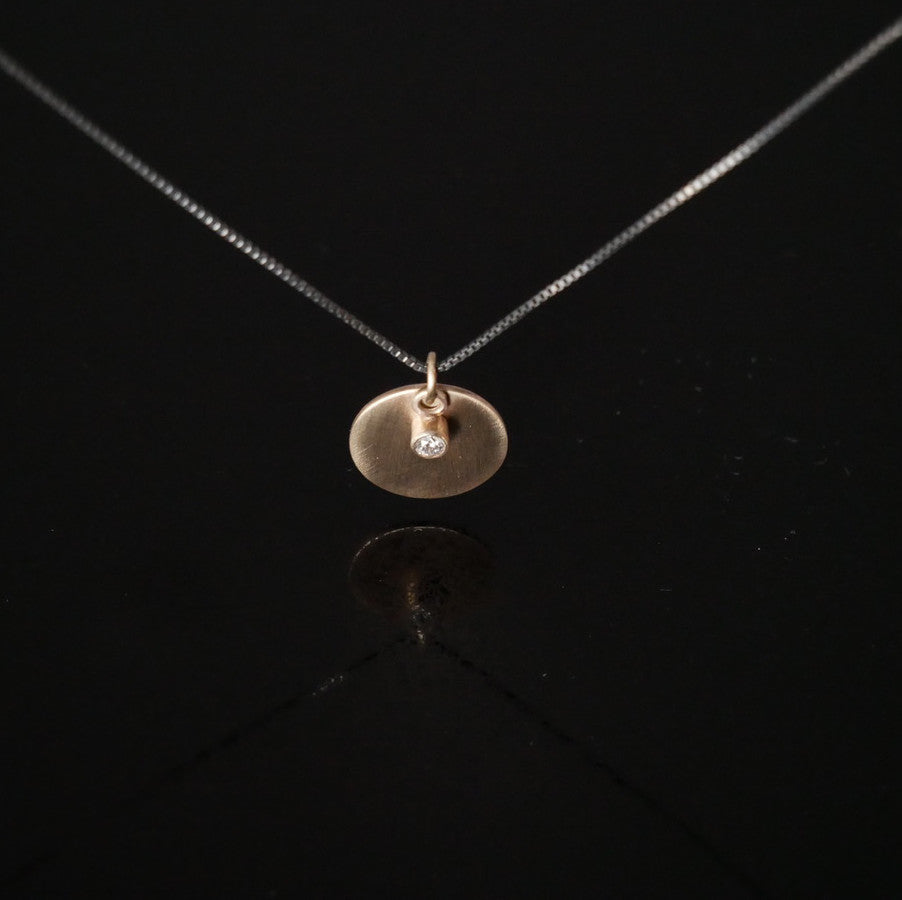 diamond and disc pendant