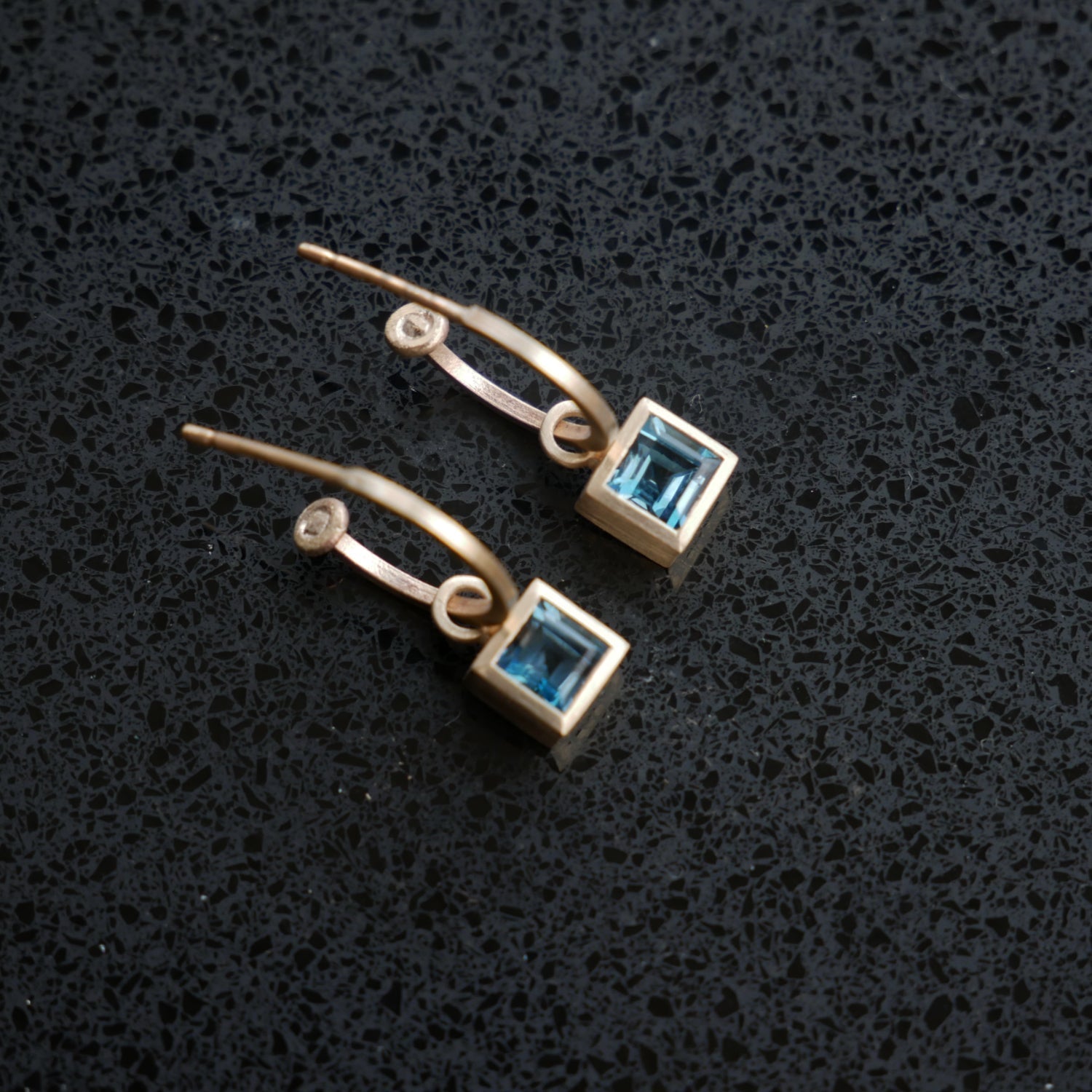 Hoop earrings with square topaz drops