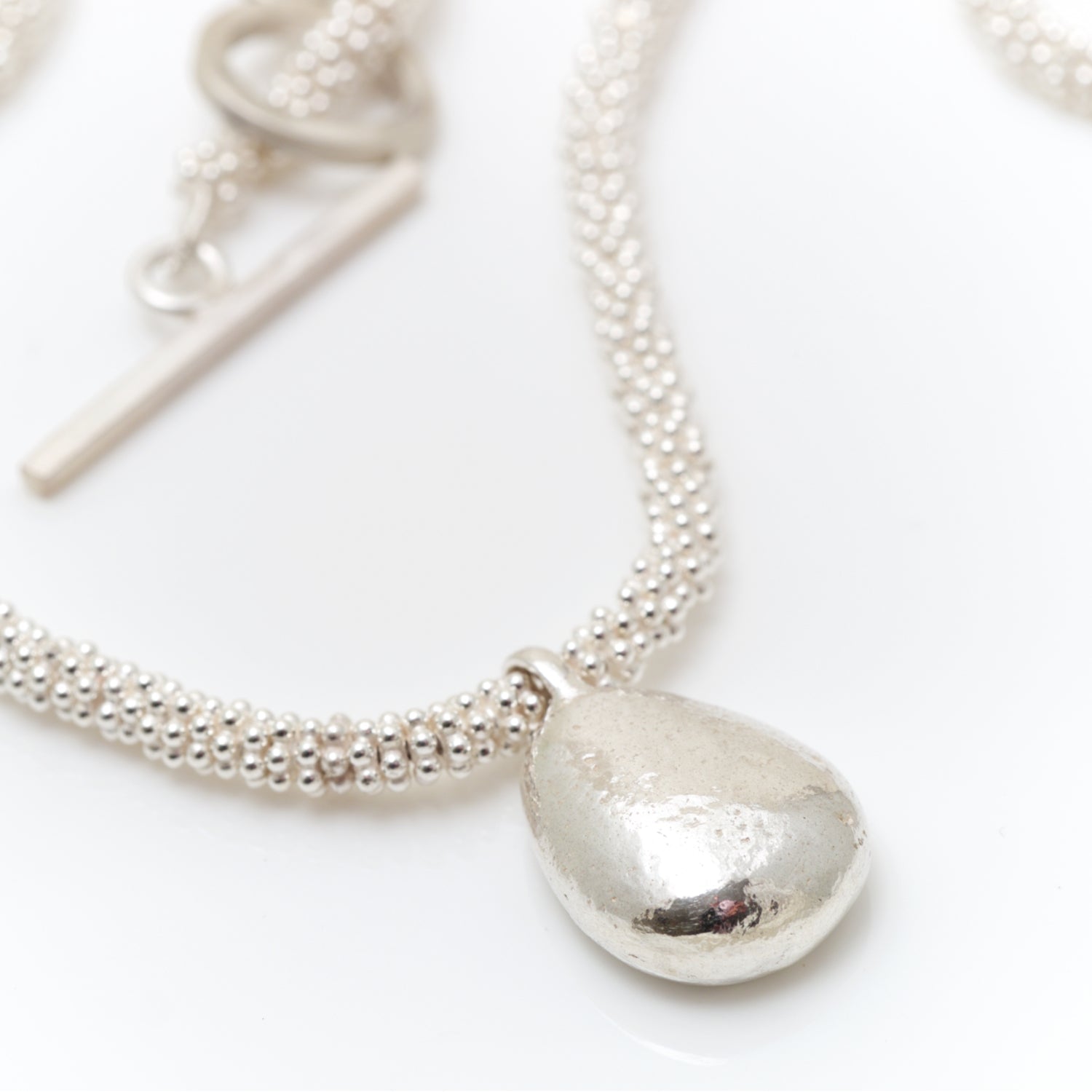 chunky silver bead necklace with pebble charm