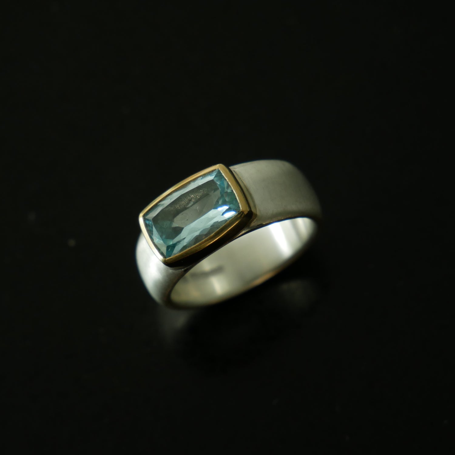 Wide silver and gold ring with cushion Topaz