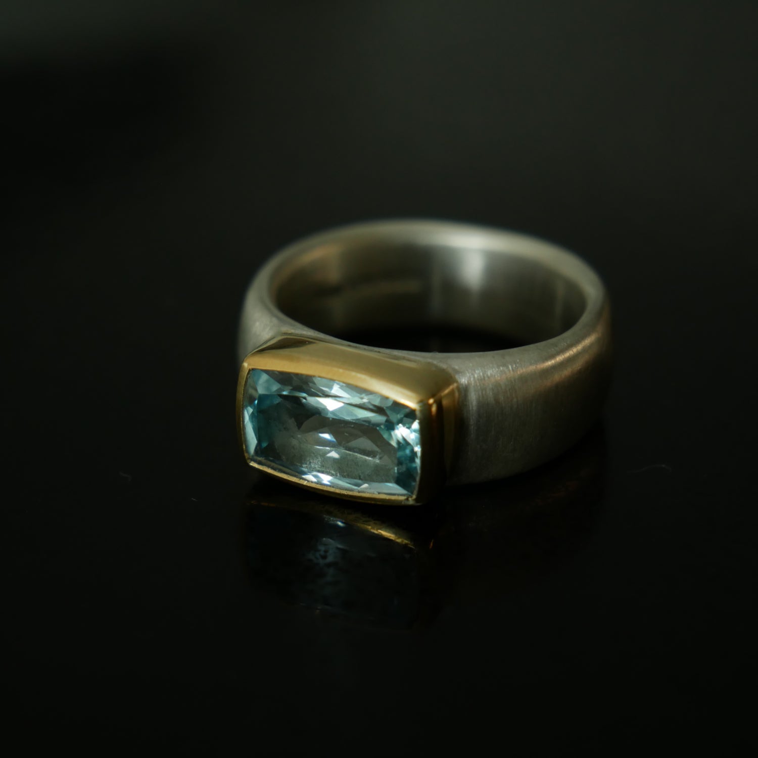 Wide silver and gold ring with cushion Topaz