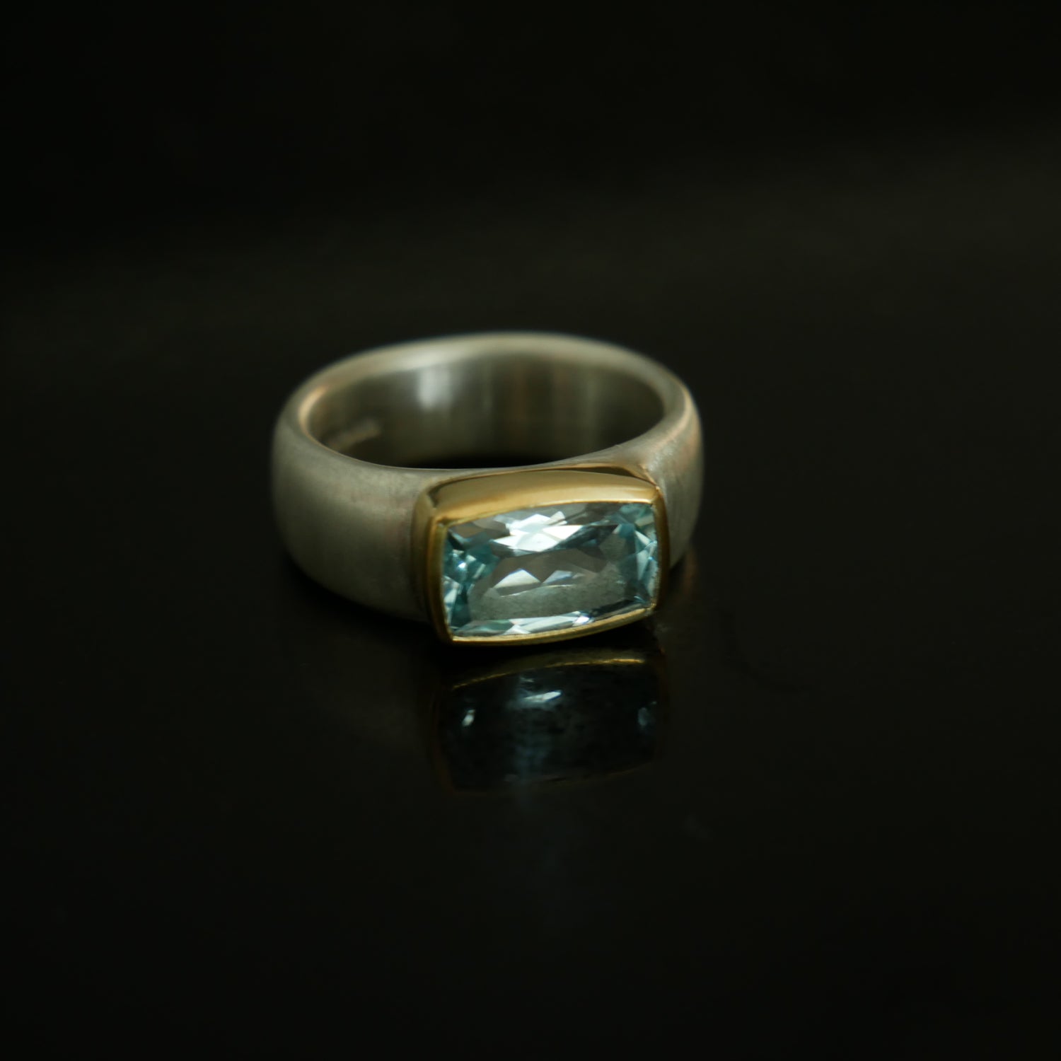 Wide silver and gold ring with cushion Topaz