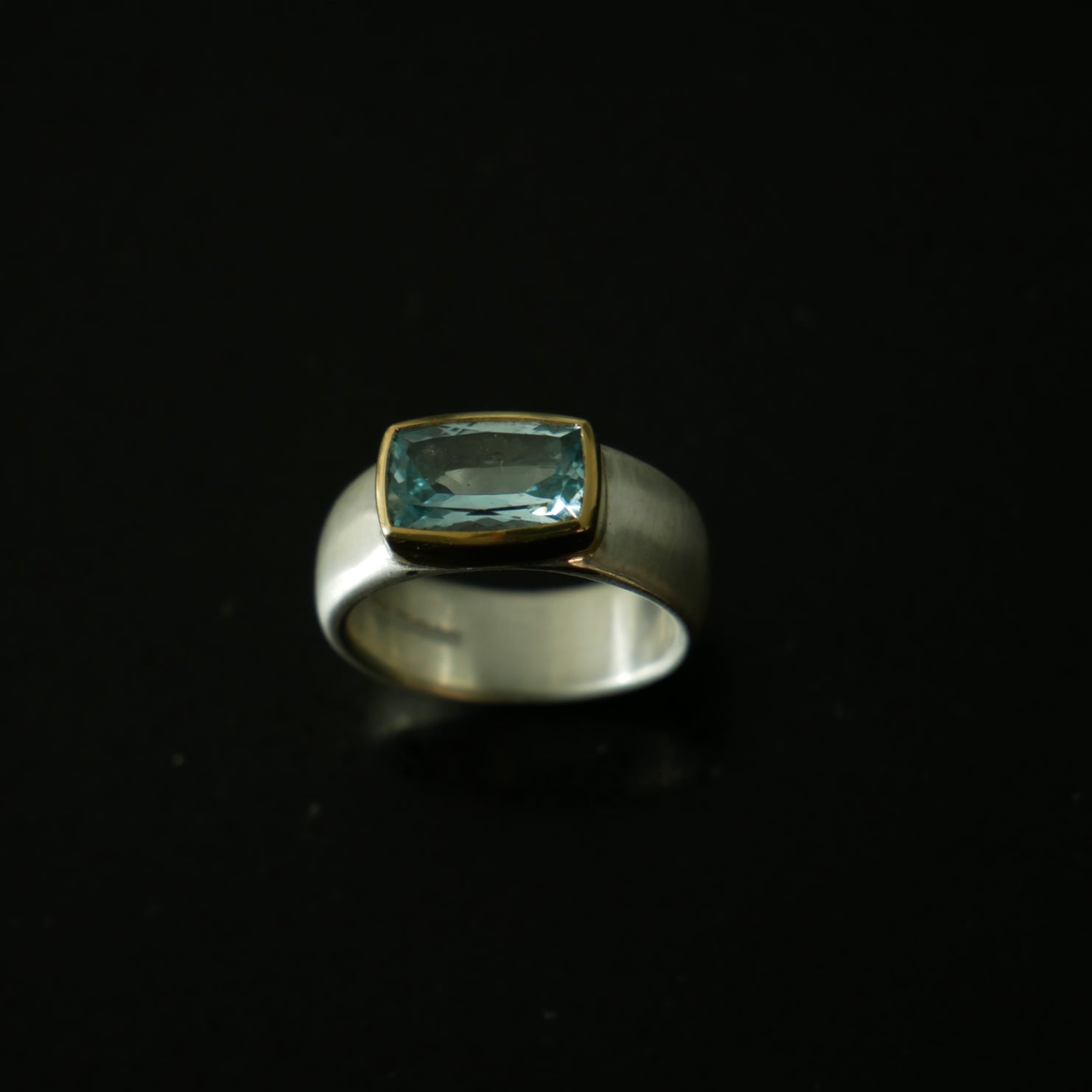 Wide silver and gold ring with cushion Topaz