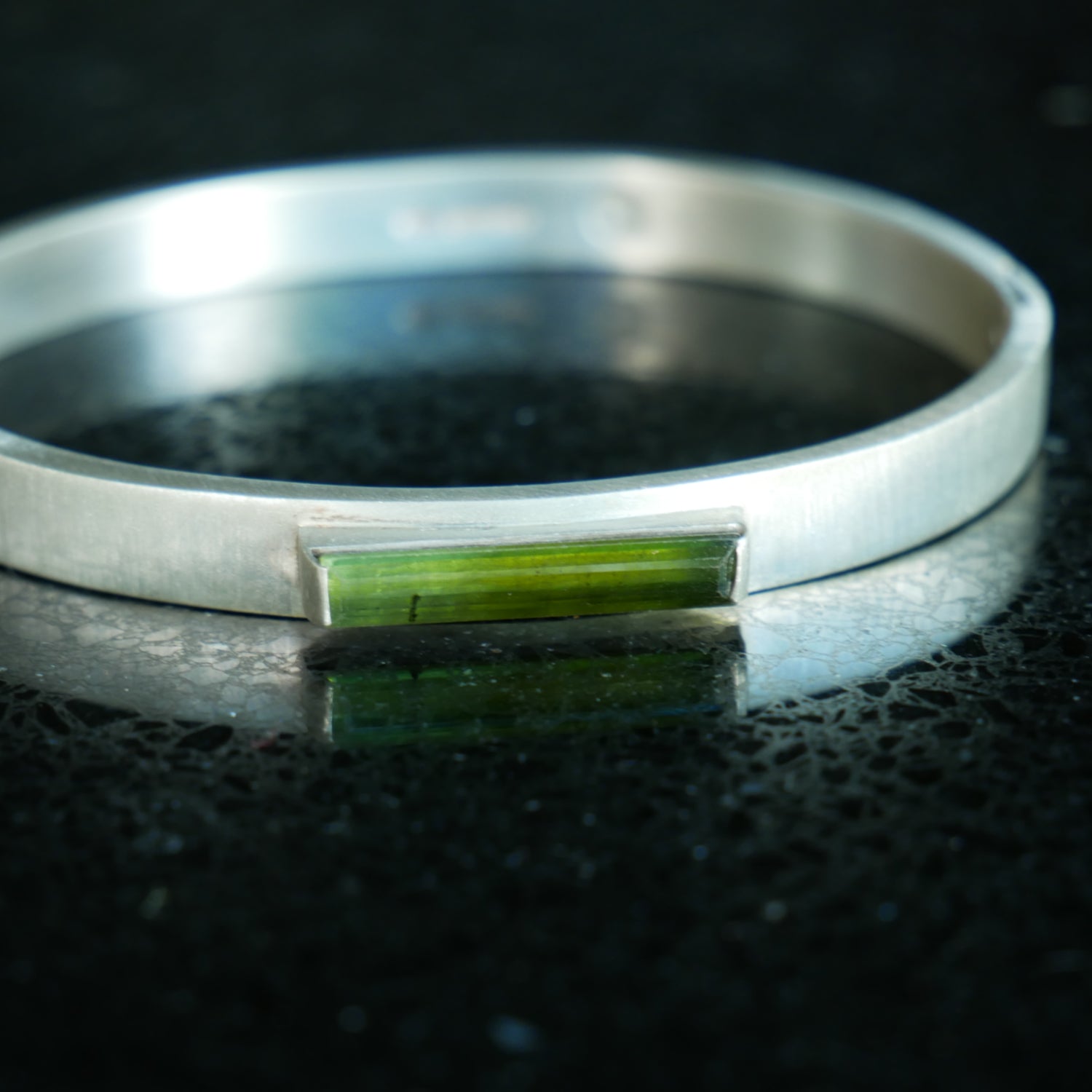 Silver hinged bracelet with green tourmaline