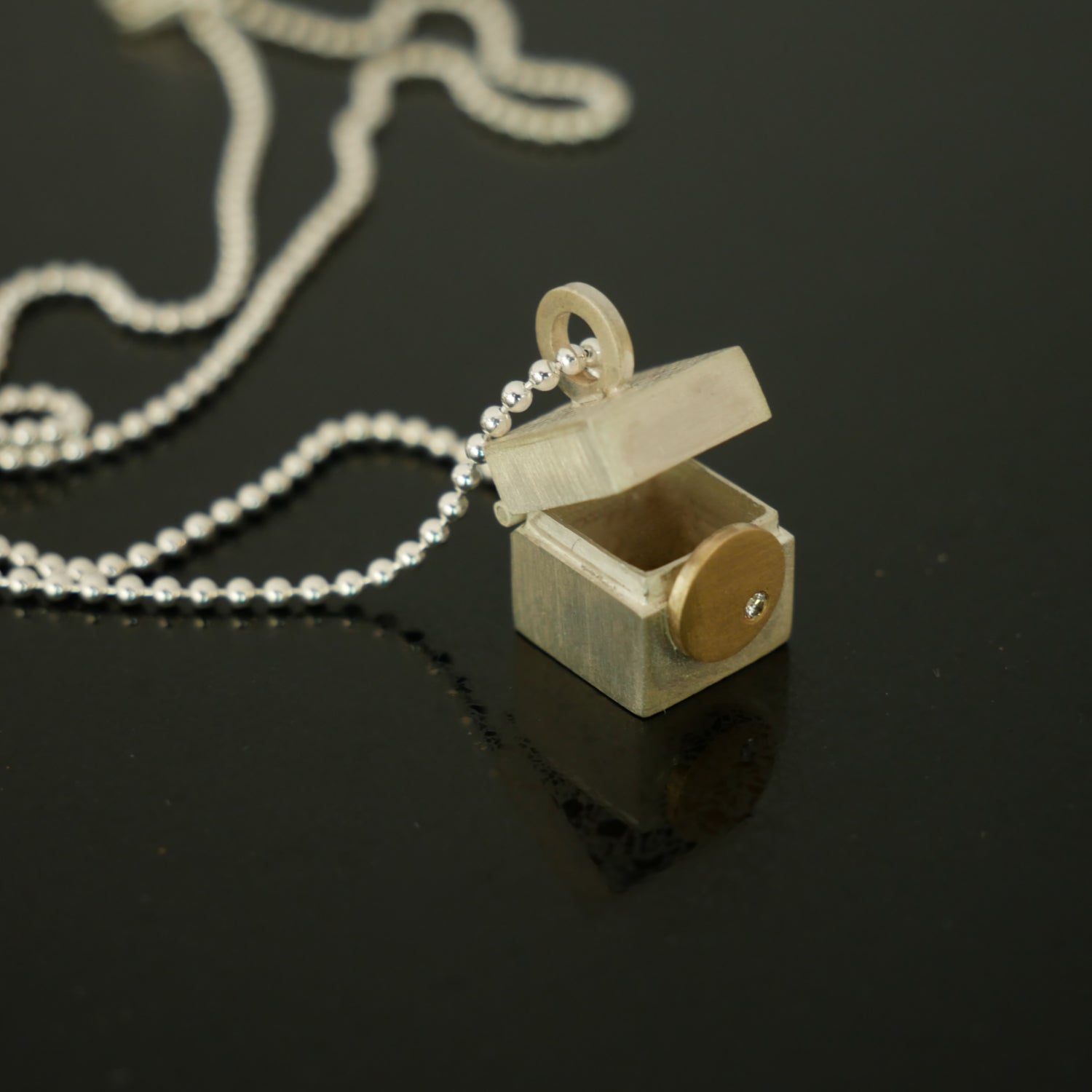 Tiny silver, gold and diamond box pendant