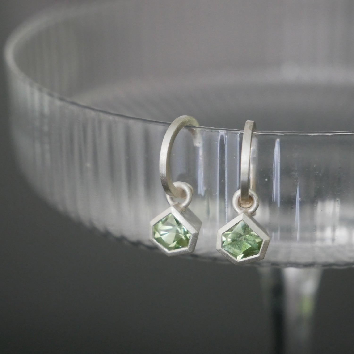 hoop earrings with geometric peridot drops