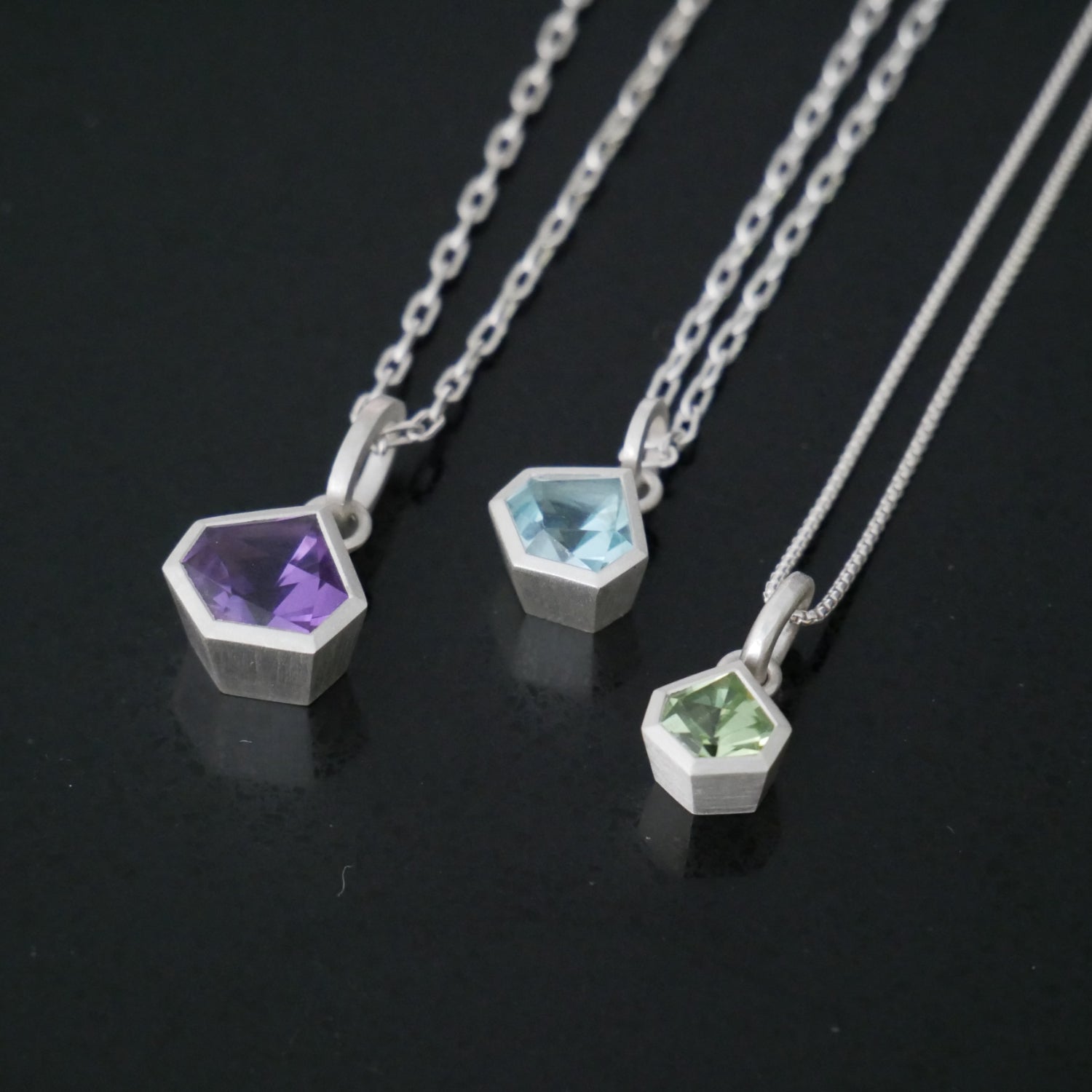 geometric pendants amethyst peridot and topaz