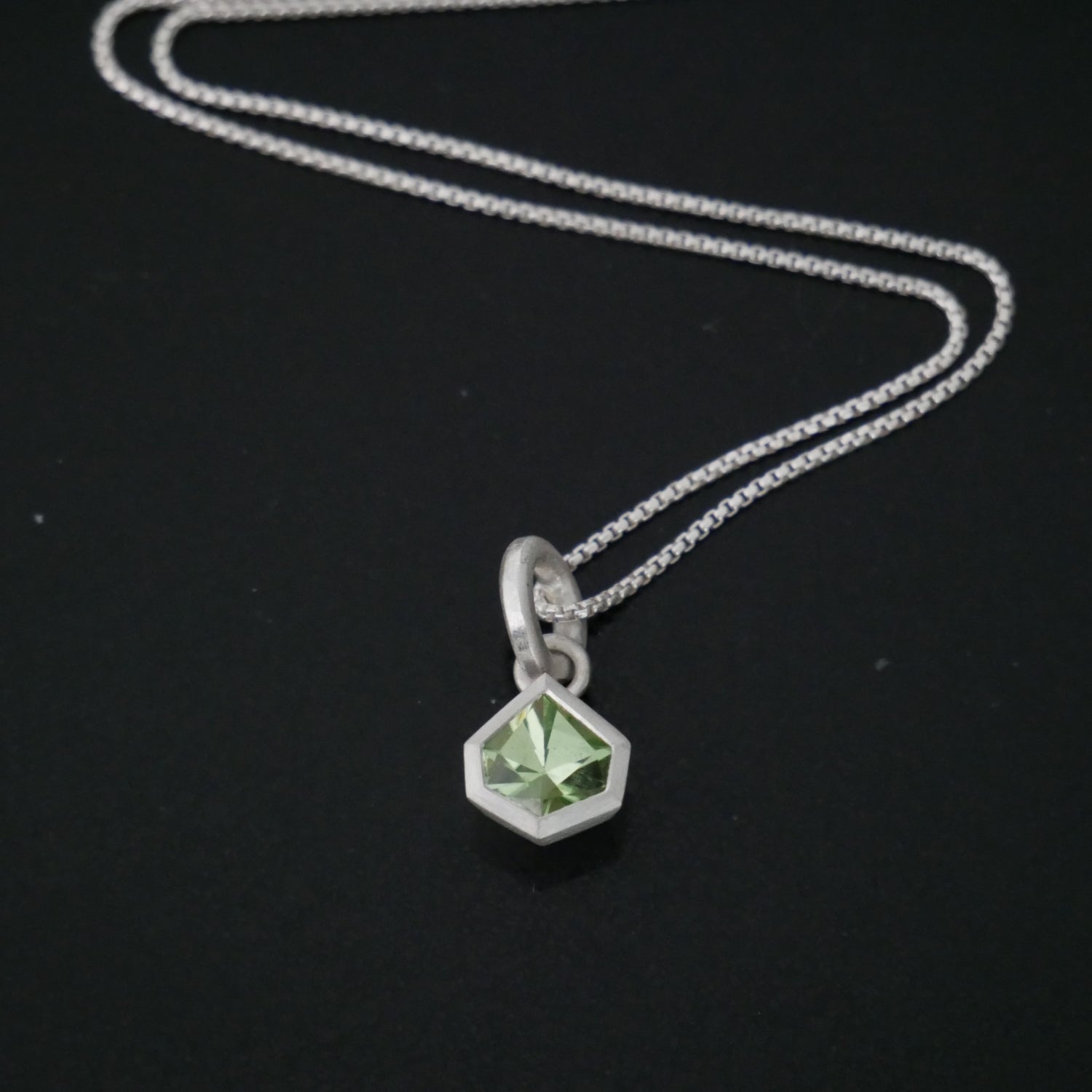 geometric silver and peridot pendant