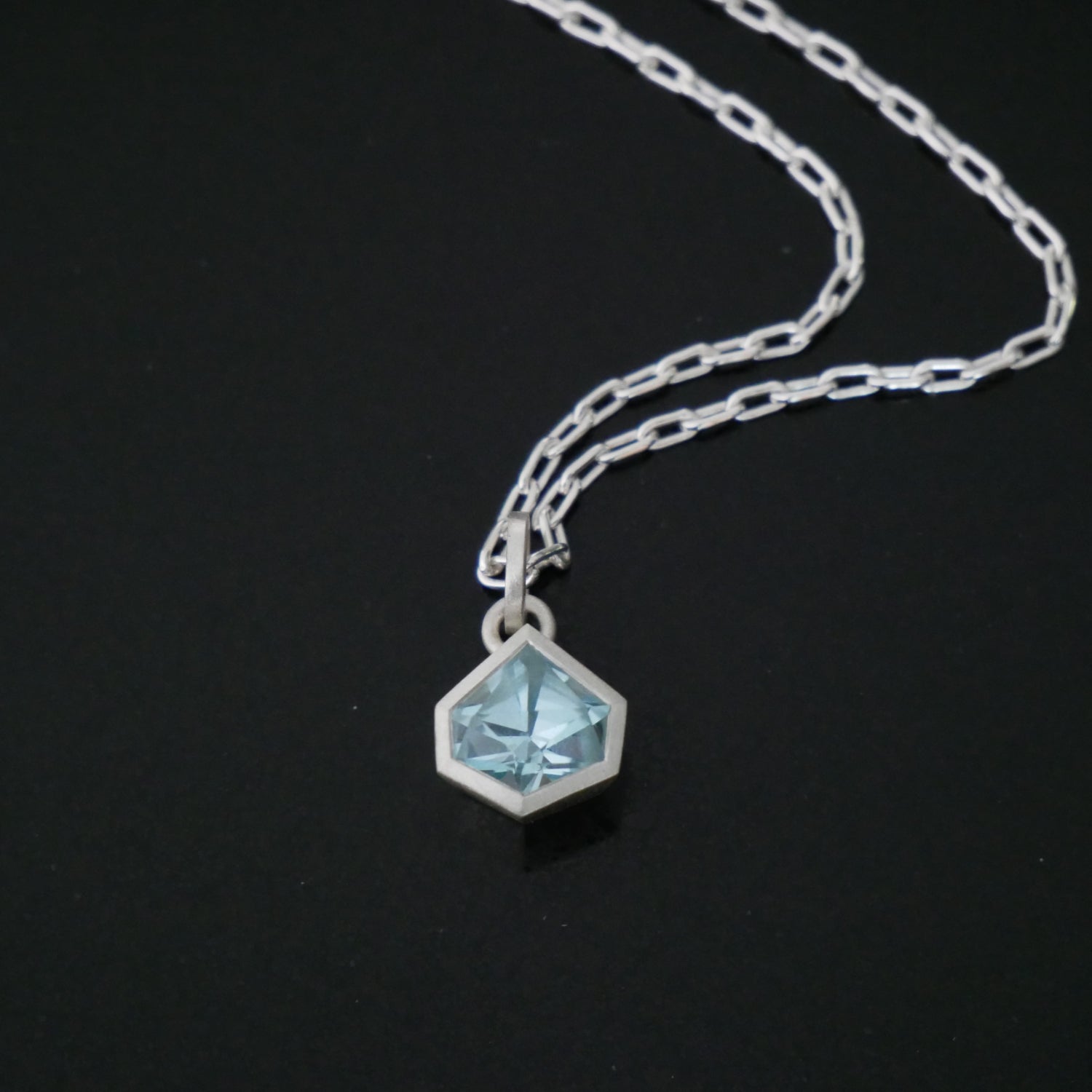 Silver link chain with geometric Topaz pendant