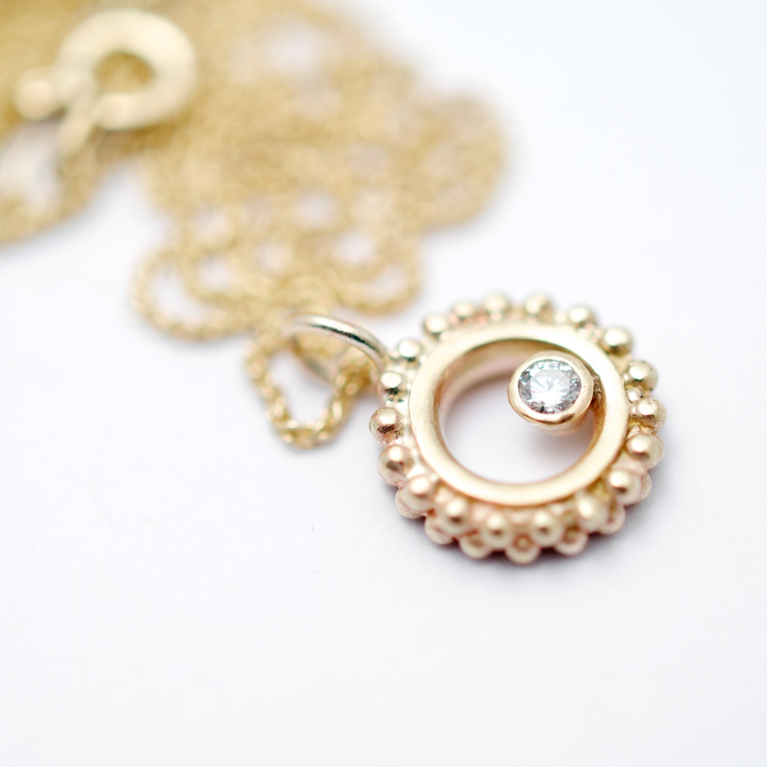 gold granulated ring necklace with diamond