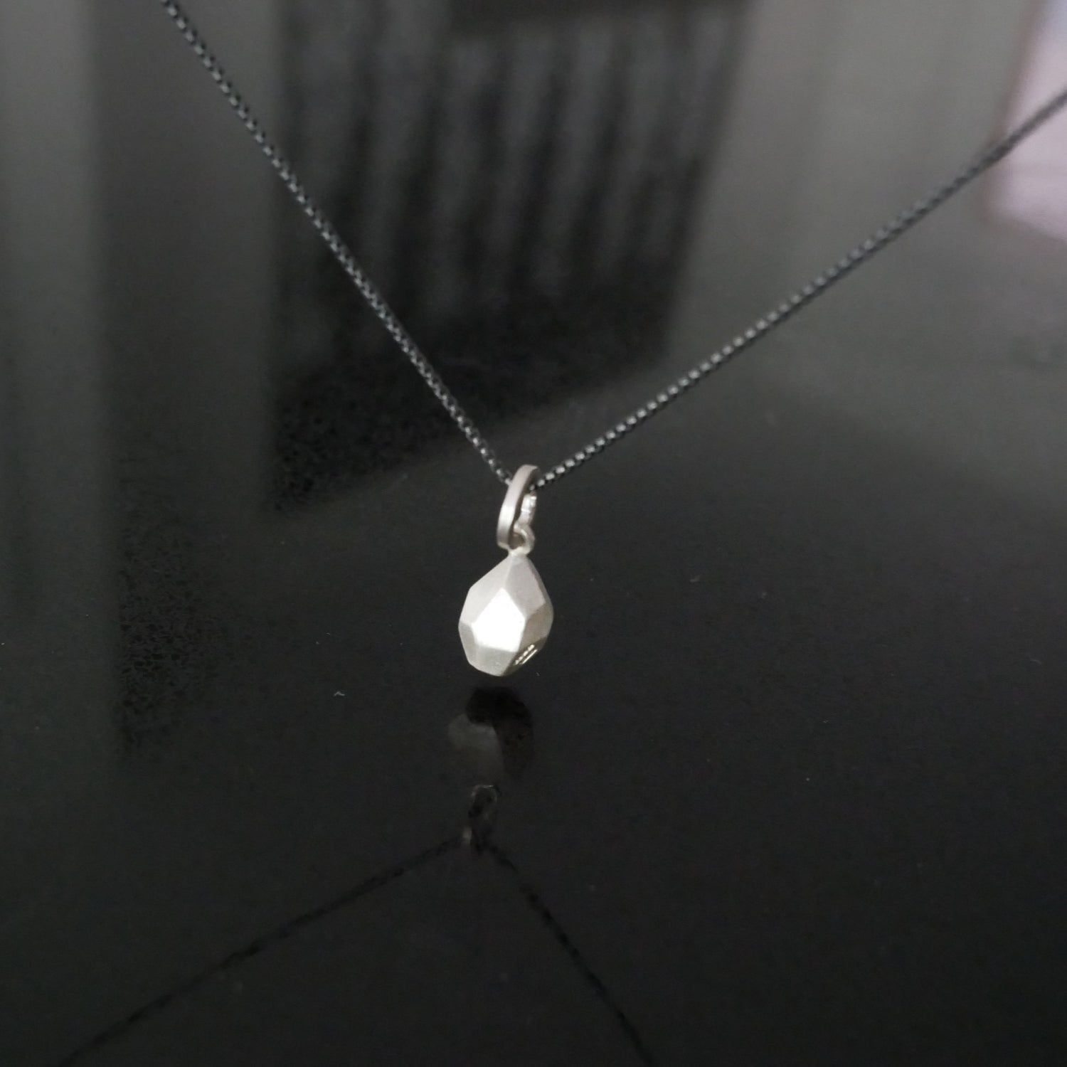 silver geometric pendant