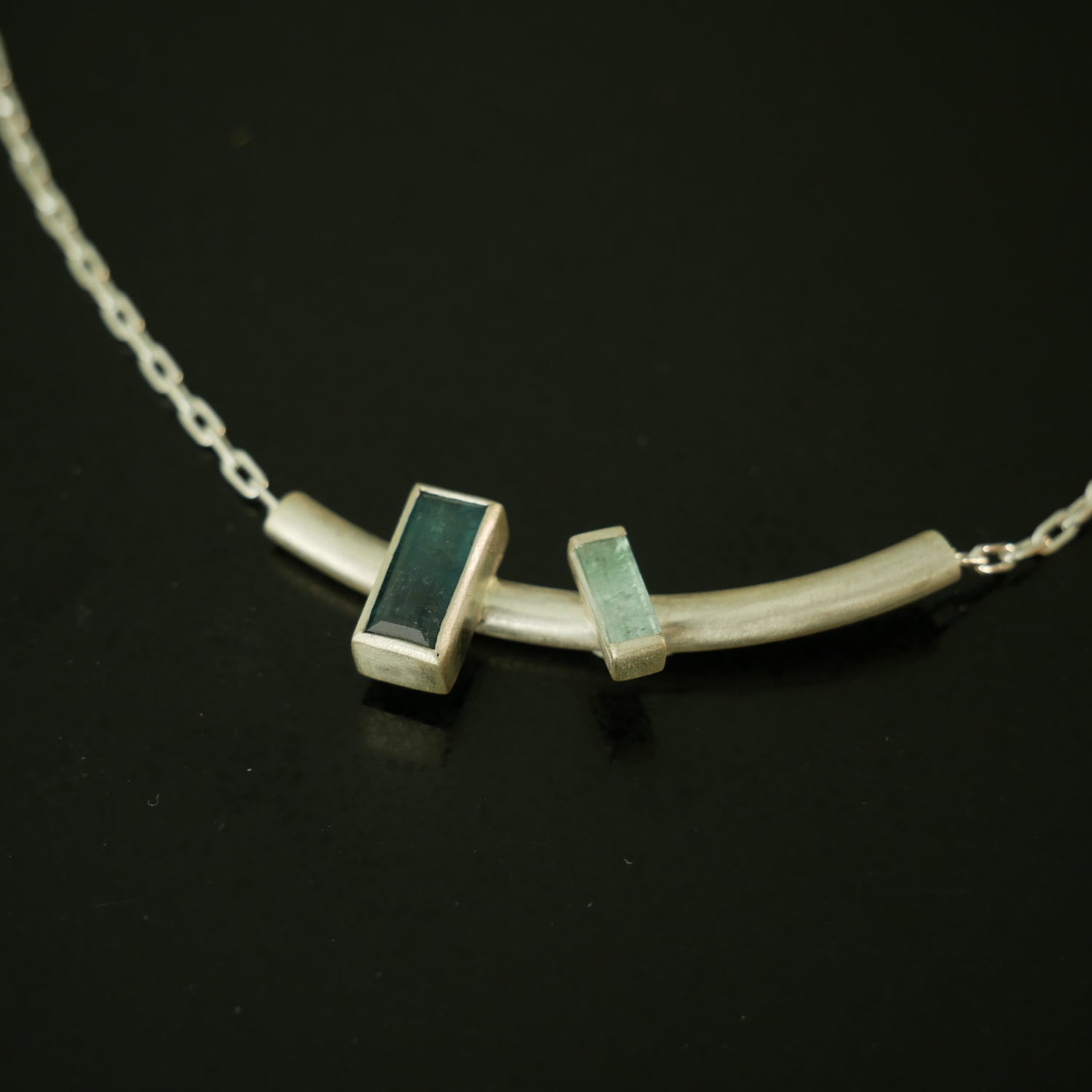 Double baguette stone silver pendant