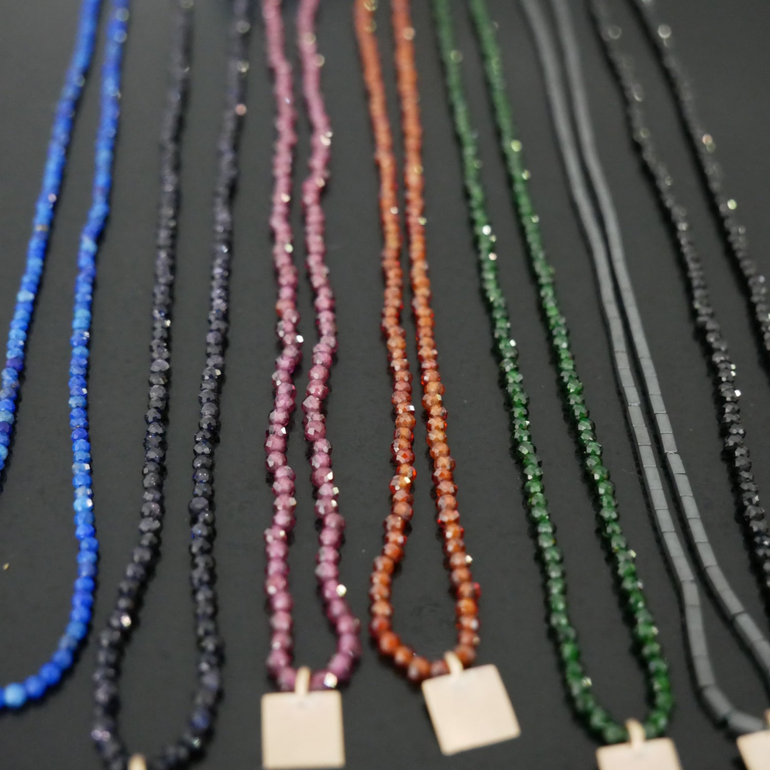 Delicate bead necklace with 9ct gold square