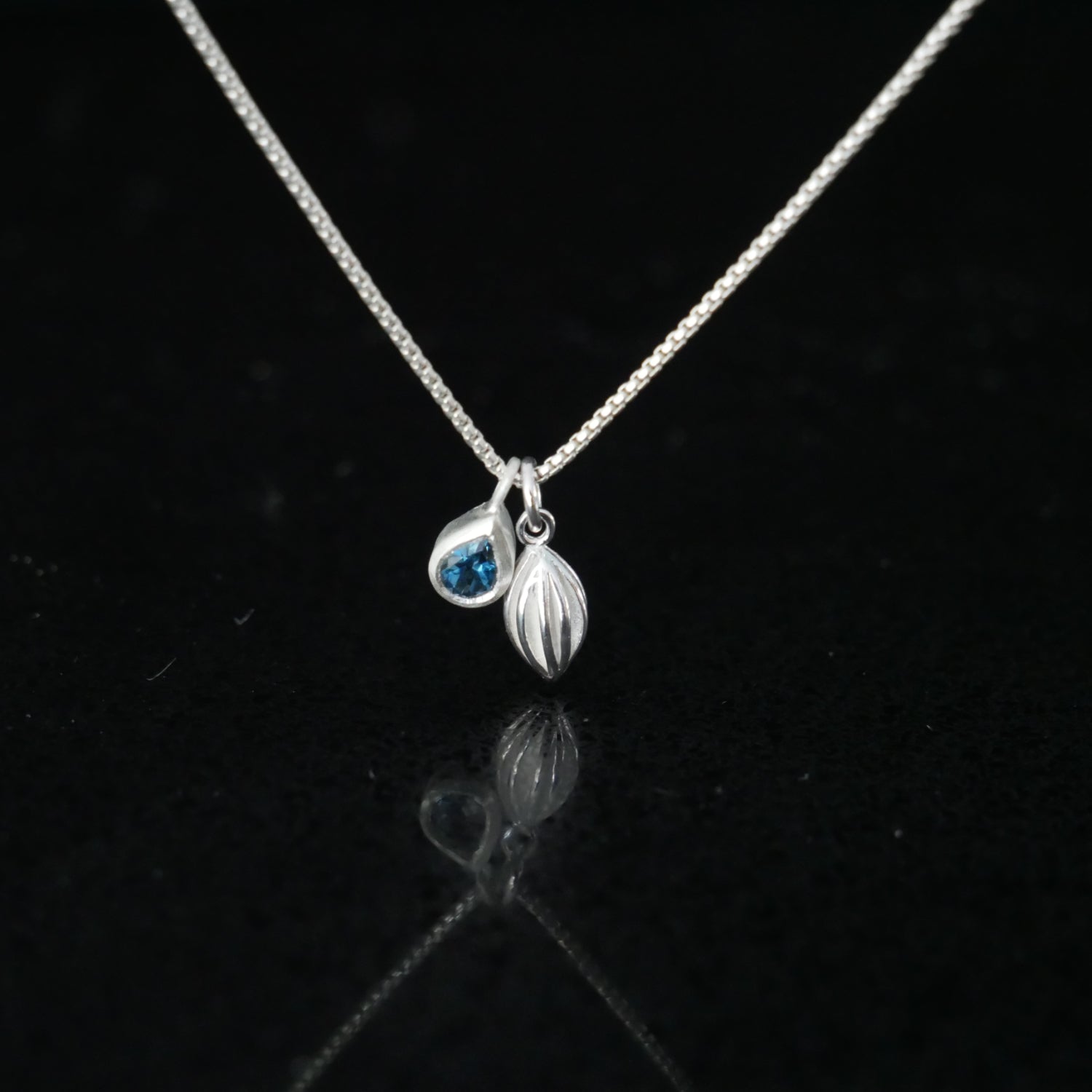 pod and topaz necklace
