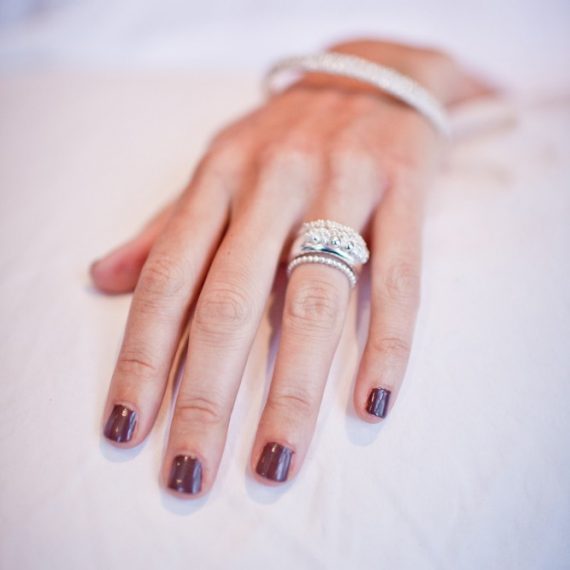 silver beaded rings on model