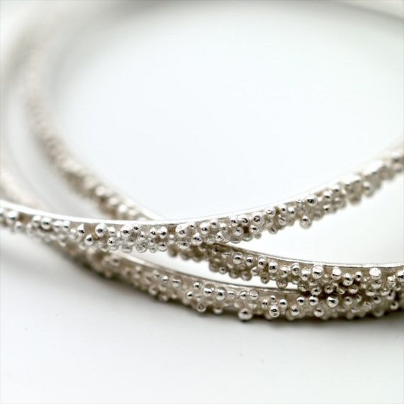 silver beaded narrow bangles on model