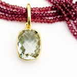 Rhodelite bead necklace with Green Amethyst set in 18ct yellow gold