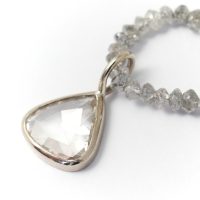 Diamond rose cut drop diamond on a string of diamond beads