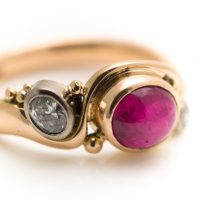 commission 18ct rose gold art deco ring with cabochon ruby and diamonds
