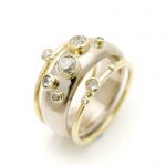 18ct wide gold ring with scattered diamonds and narrow 18ct gold rings
