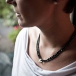 Haematite bead necklace with silver beaded charm