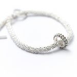 Silver decorative bead bracelet with beaded ring charm