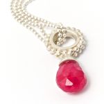 Silver tiny beaded ring pendant with a ruby drop