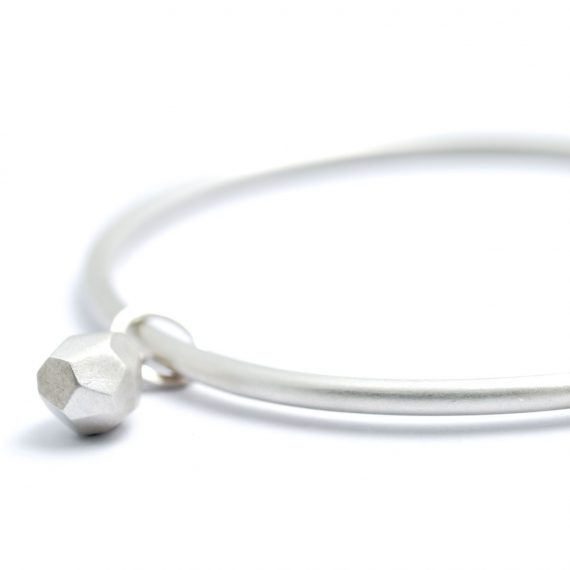 Silver plain bangle with Flint inspired charm