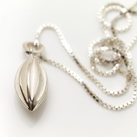 Silver medium pod drop necklace on box chain