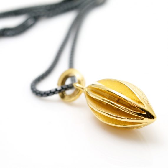 Medium gold plated pod necklace on oxydised silver chain still shot 2