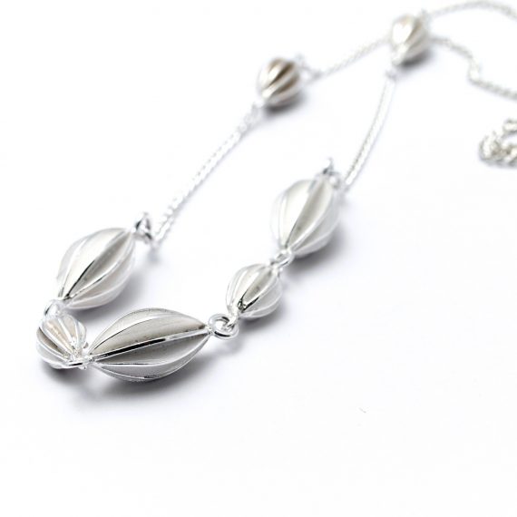 Silver semi continuous pod necklace